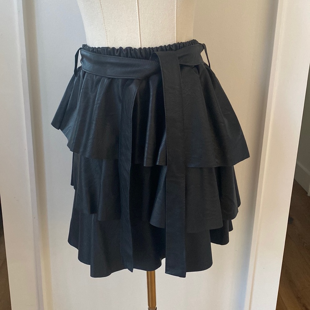 Faux leather skirt. Worn once! Super cute. Menopause too small!